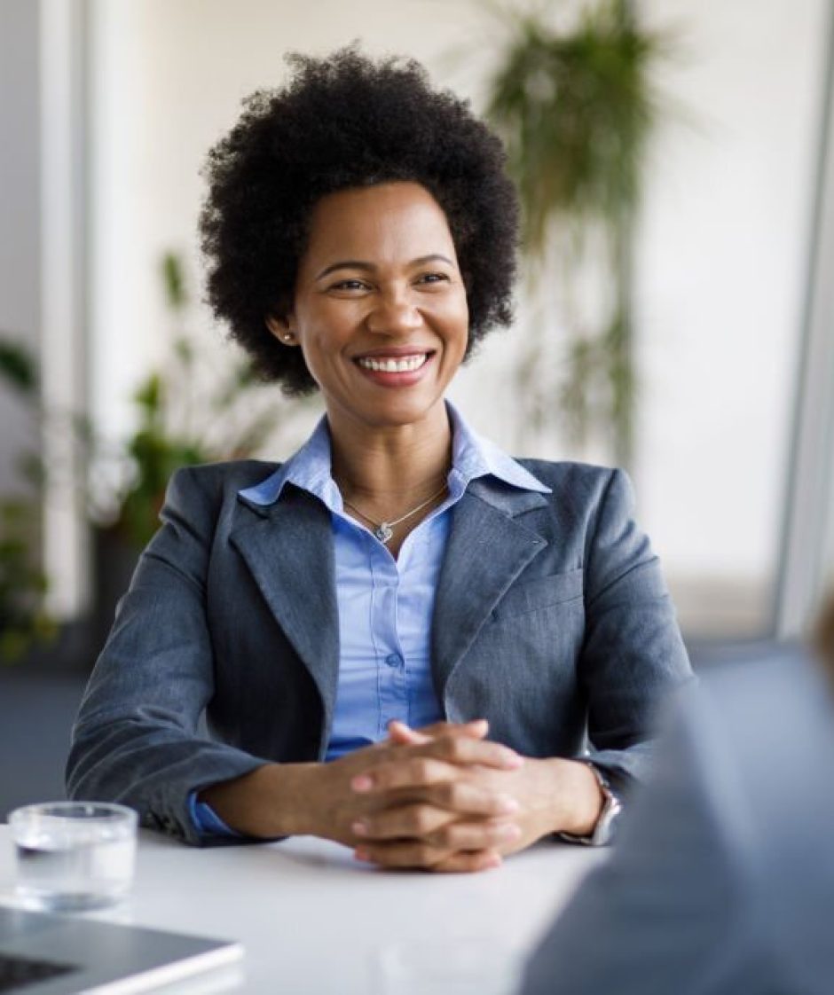 Two diverse businesswomen talking working together in office Two diverse businesswomen talking working together in office